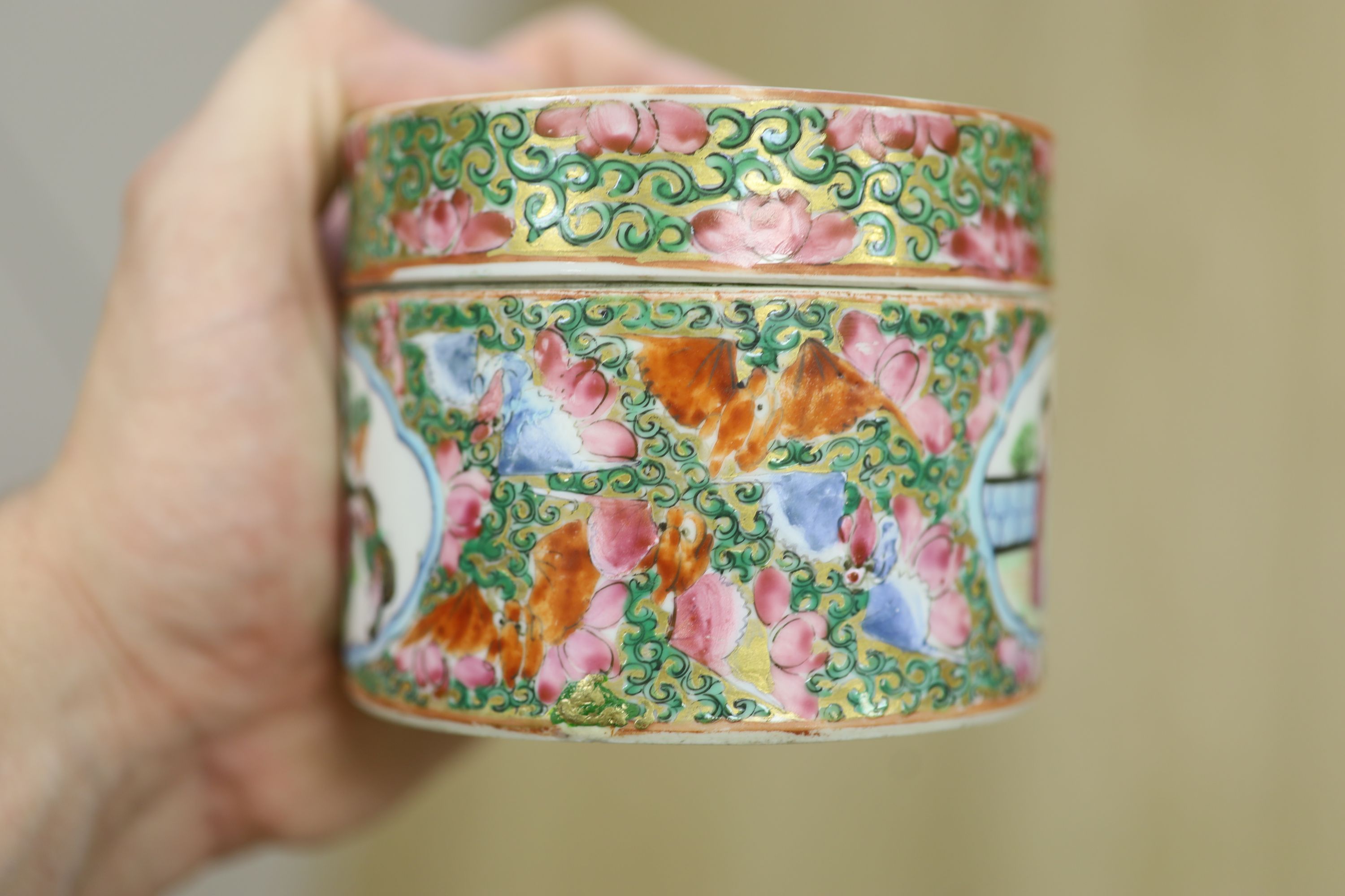 A Chinese famille rose box and cover, two vases, a sugar bowl and cover and a saucer, late 19th/early 20th century, tallest 19cm